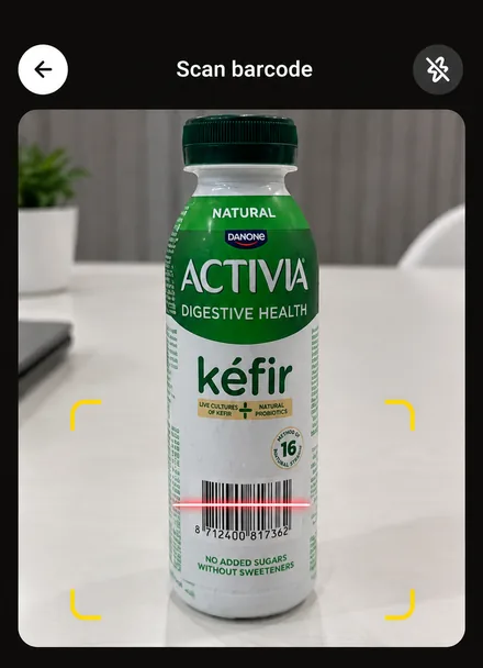 Real app screen: the barcode scanner framing the code on the bottle